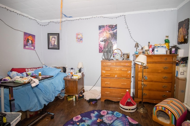 bedroom with wood finished floors