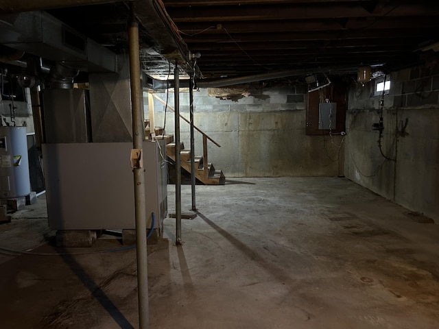 basement featuring heating unit, stairs, electric panel, and electric water heater