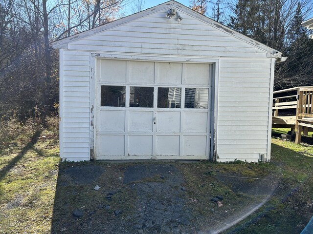 detached garage featuring driveway