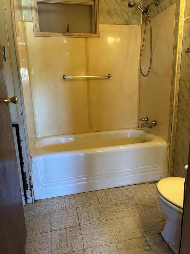 full bathroom featuring shower / bathing tub combination and toilet