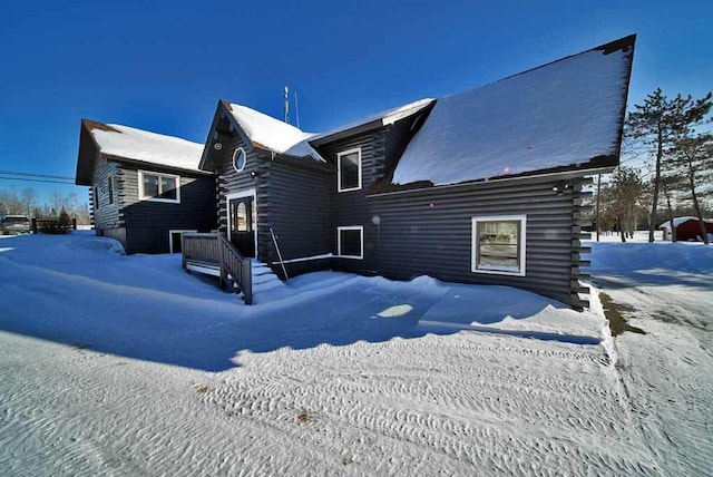 view of front of property featuring log siding