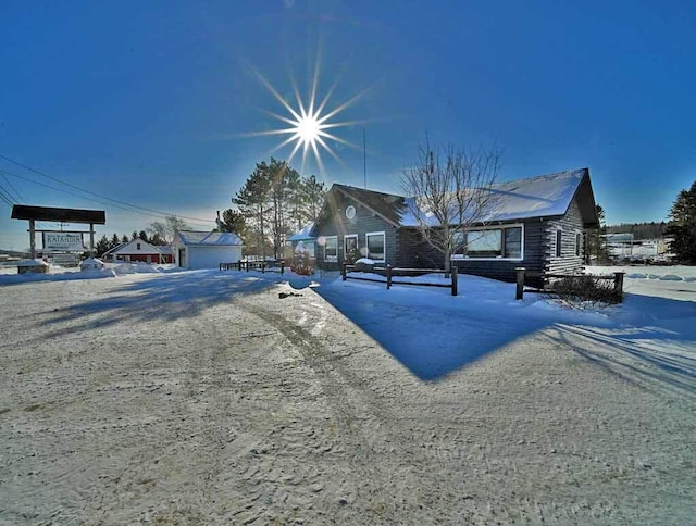 view of front of home with log siding