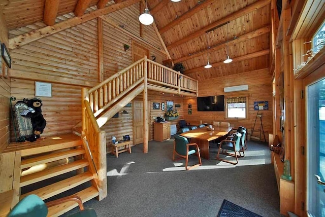 carpeted dining room with high vaulted ceiling, wood ceiling, stairway, a wall mounted AC, and beamed ceiling