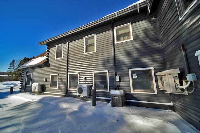 rear view of property with ac unit and a patio