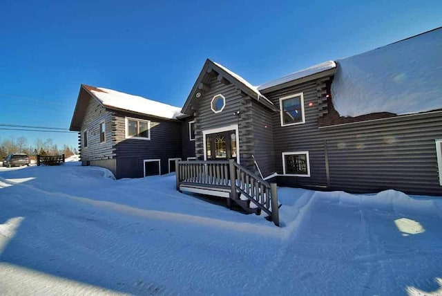 log-style house featuring log siding