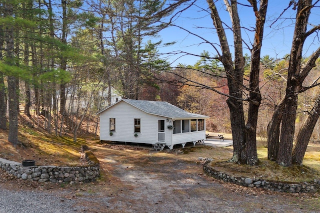 view of front of house with a sunroom