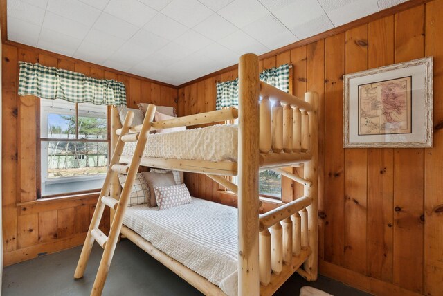 bedroom with wooden walls