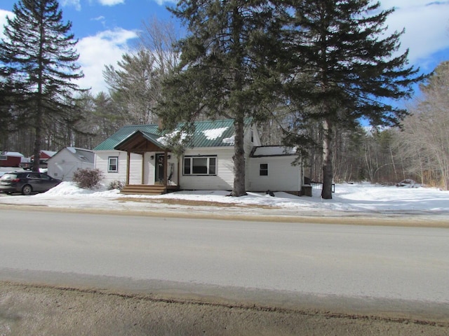 view of front of home featuring metal roof