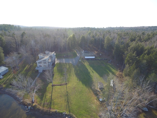 aerial view featuring a wooded view