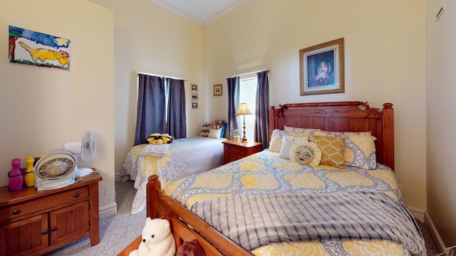 bedroom featuring carpet floors, baseboards, and ornamental molding