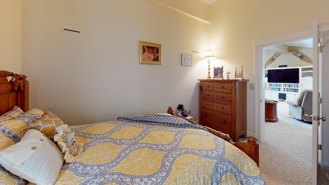 carpeted bedroom featuring vaulted ceiling with beams