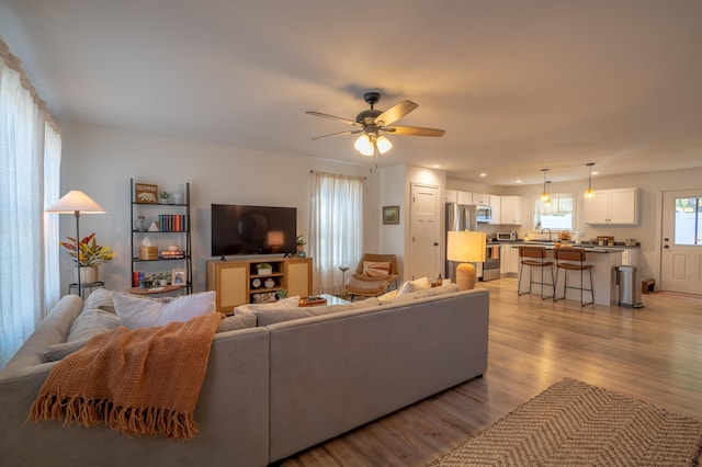 46 Firefly Ln, Bangor, ME 04401 - living area featuring light wood-style floors and ceiling fan