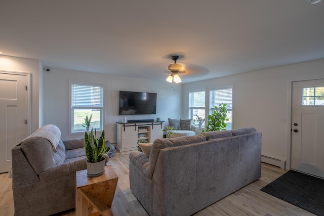 46 Firefly Ln, Bangor, ME 04401 - living room with baseboard heating, light wood-style flooring, and a ceiling fan