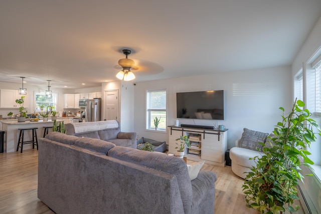 46 Firefly Ln, Bangor, ME 04401 - living area with light wood-style flooring and ceiling fan