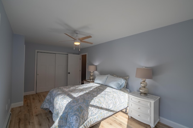 46 Firefly Ln, Bangor, ME 04401 - bedroom with a baseboard radiator, light wood finished floors, a closet, and ceiling fan