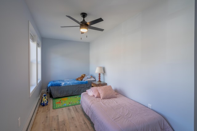 46 Firefly Ln, Bangor, ME 04401 - bedroom featuring a baseboard heating unit, light wood-style floors, and ceiling fan