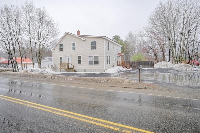 view of front of property featuring a chimney