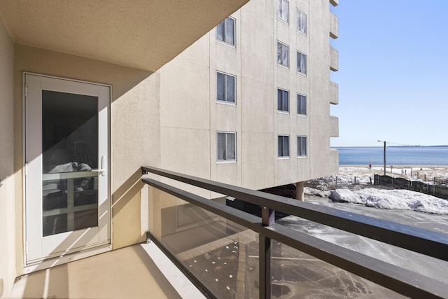 balcony with a view of the beach and a water view