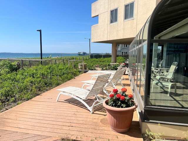 deck featuring a water view