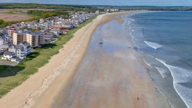 aerial view featuring a water view and a beach view