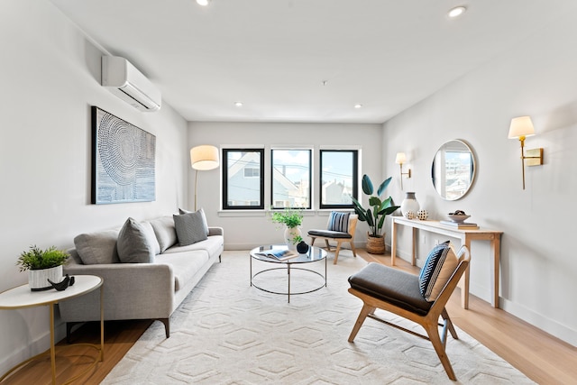 living area featuring recessed lighting, wood finished floors, and a wall mounted air conditioner