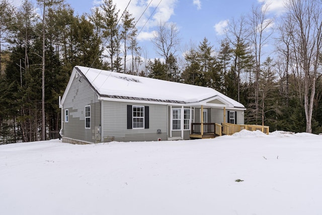 view of front of house featuring a wooden deck