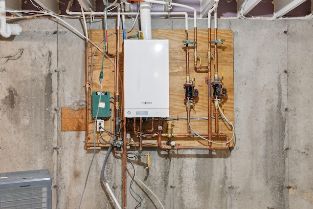 utility room with tankless water heater