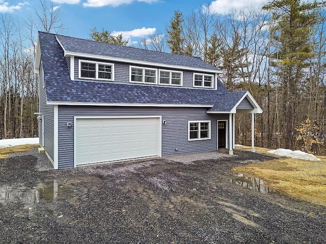 garage featuring dirt driveway