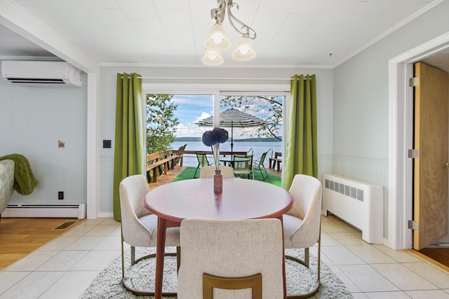 dining area with a wall unit AC, a notable chandelier, light tile patterned floors, a baseboard radiator, and radiator