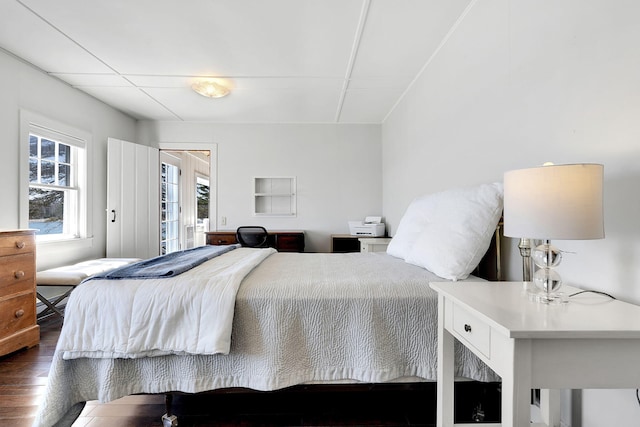 bedroom with dark wood-type flooring