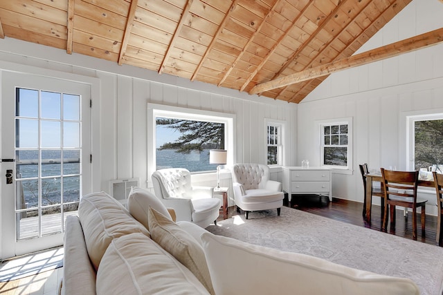 living area with high vaulted ceiling, wooden ceiling, a water view, wood finished floors, and beamed ceiling