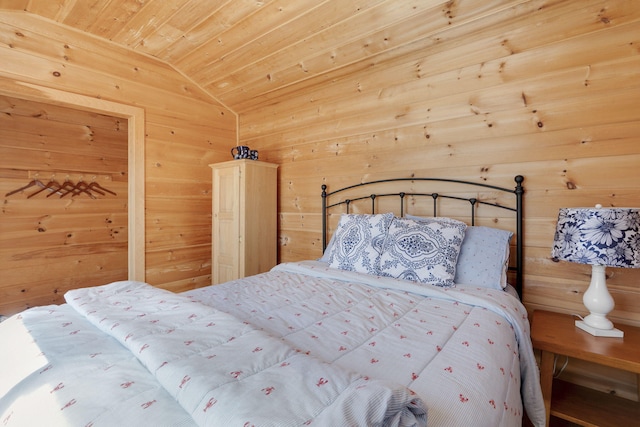 unfurnished bedroom with lofted ceiling, wood ceiling, and wooden walls