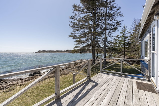 wooden terrace with a water view