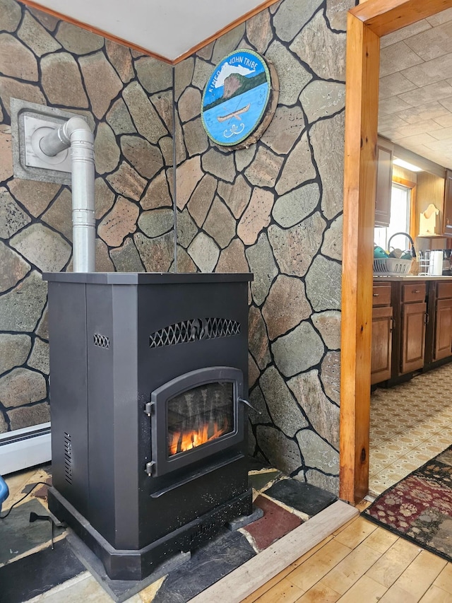 51 N Guilford Rd, Monson, ME 04464 - detailed view of a wood stove and wood finished floors