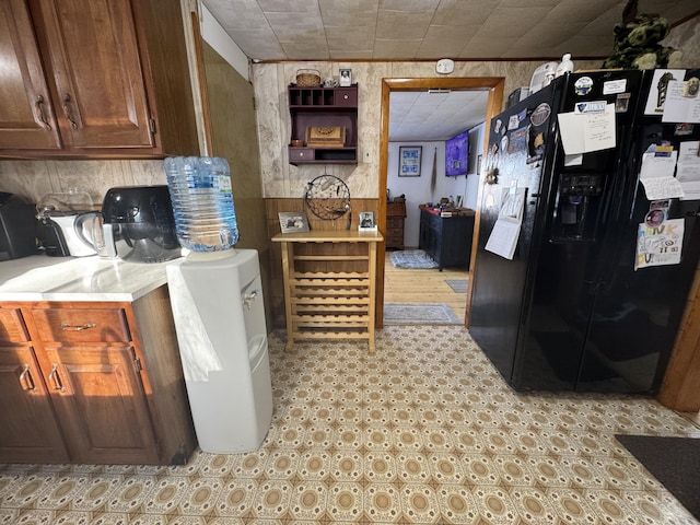 51 N Guilford Rd, Monson, ME 04464 - kitchen with black refrigerator with ice dispenser, light floors, and light countertops
