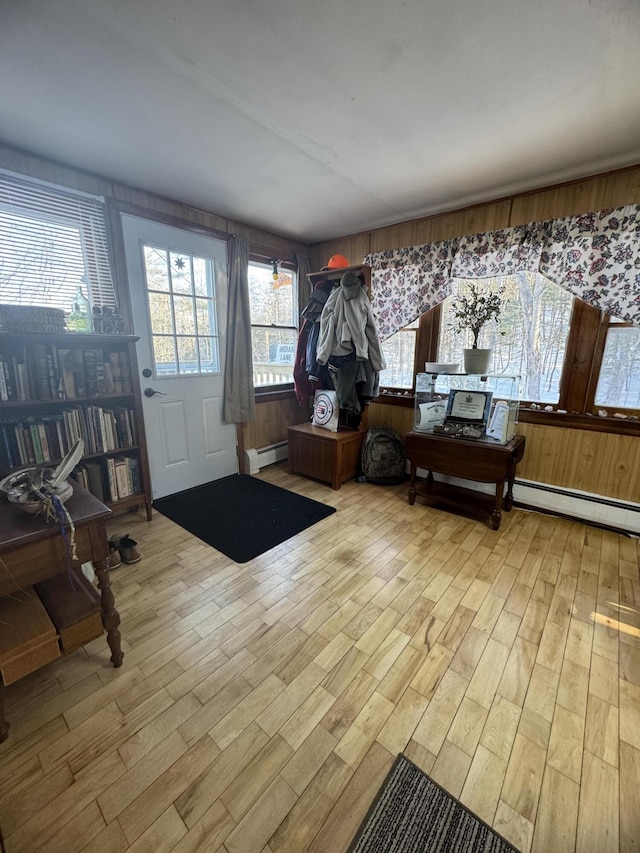 51 N Guilford Rd, Monson, ME 04464 - foyer entrance with baseboard heating and wood finished floors