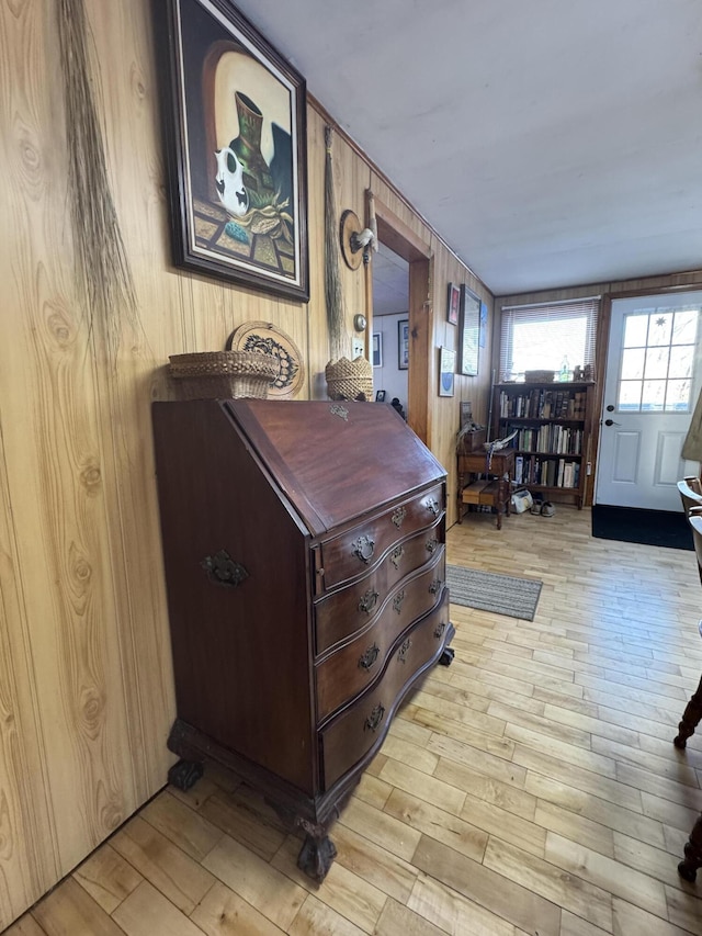 51 N Guilford Rd, Monson, ME 04464 - foyer with light wood-type flooring and wooden walls