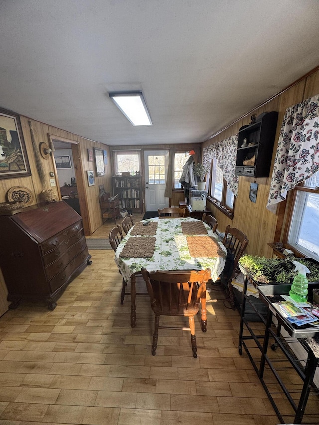 51 N Guilford Rd, Monson, ME 04464 - dining area with light wood-style floors and wooden walls