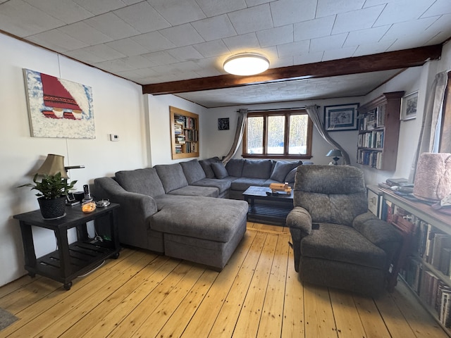 51 N Guilford Rd, Monson, ME 04464 - living area with beamed ceiling and light wood-type flooring