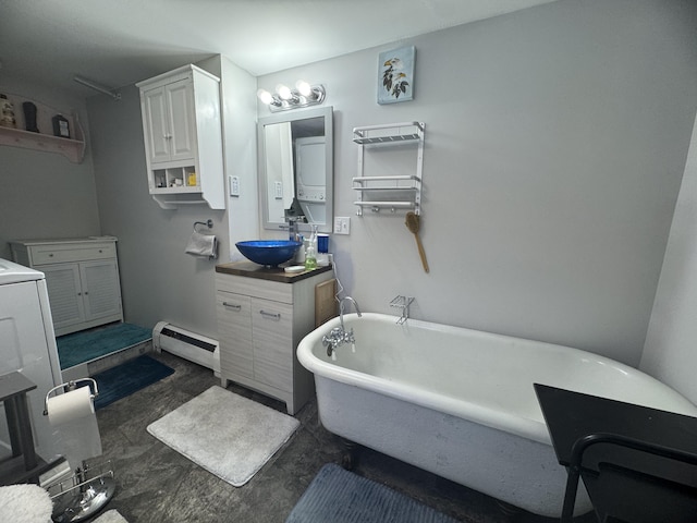 51 N Guilford Rd, Monson, ME 04464 - bathroom featuring baseboard heating, vanity, and a freestanding bath