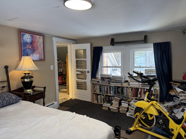 51 N Guilford Rd, Monson, ME 04464 - bedroom with a baseboard heating unit and dark colored carpet