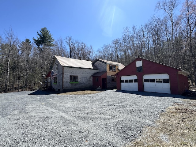 51 N Guilford Rd, Monson, ME 04464 - view of front of home with a garage and driveway