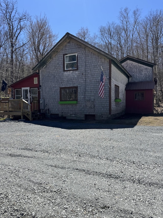 51 N Guilford Rd, Monson, ME 04464 - view of front facade with a wooden deck