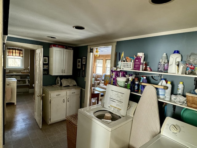 laundry room with ceiling fan, washer / clothes dryer, cabinet space, and ornamental molding