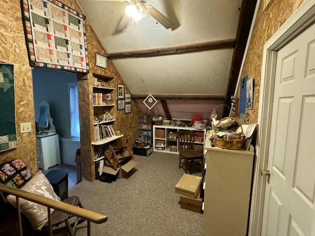 carpeted office featuring ceiling fan and vaulted ceiling