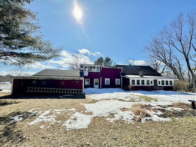 view of snow covered house