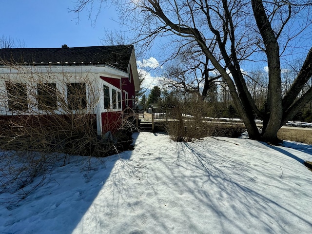 yard covered in snow featuring a wooden deck