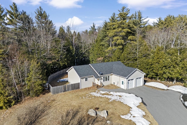 drone / aerial view featuring a view of trees