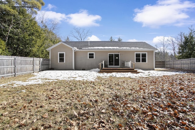 back of house with crawl space, a wooden deck, and a fenced backyard