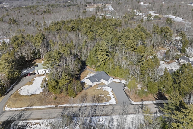 drone / aerial view featuring a view of trees